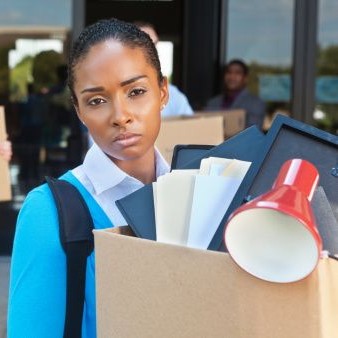 Woman leaving office after being fired