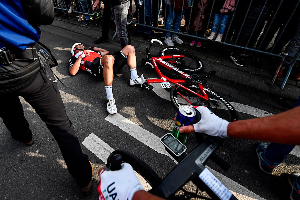 John Degenkolb collapses after finishing second at Gent-Wevelgem