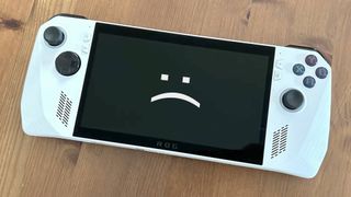 Asus ROG Ally with sad text face on screen.