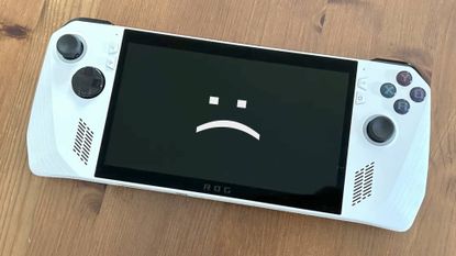 Asus ROG Ally with sad text face on screen.