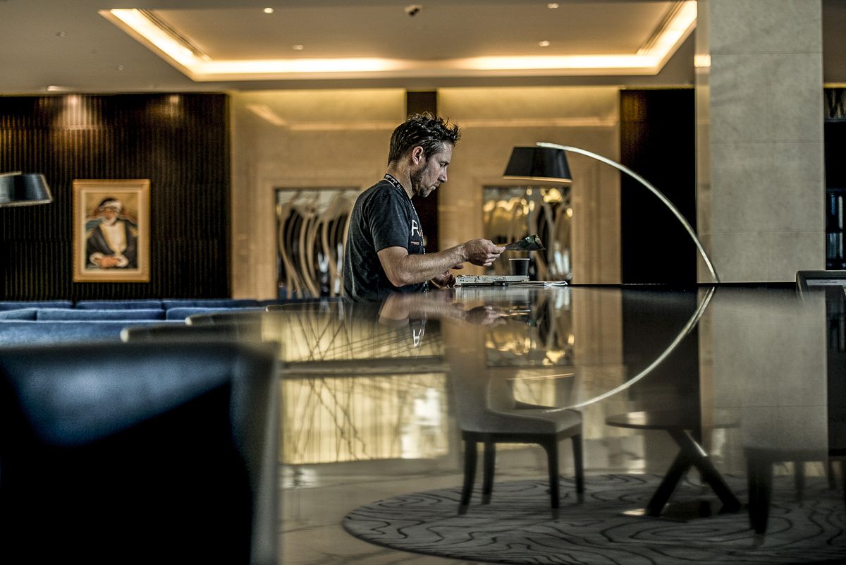 Eric Wohlberg team Director takes some time alone in the hotel foyer preaparing for the day ahead