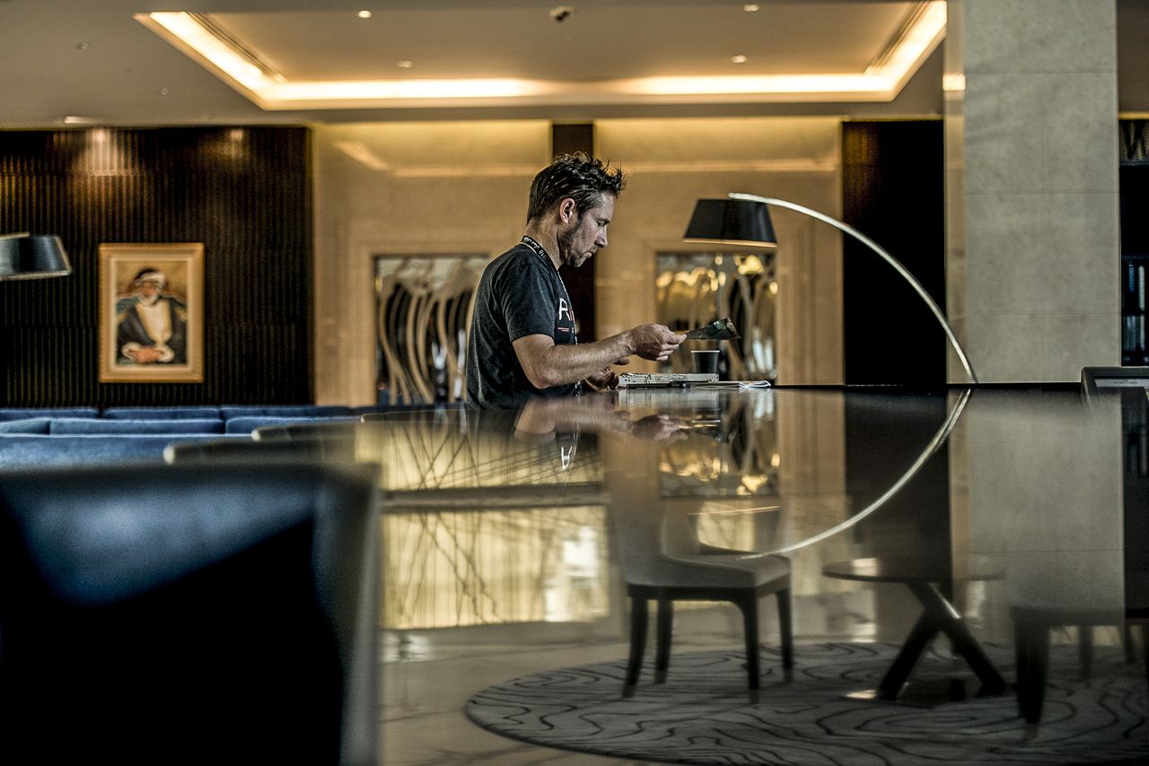 Eric Wohlberg team Director takes some time alone in the hotel foyer preaparing for the day ahead