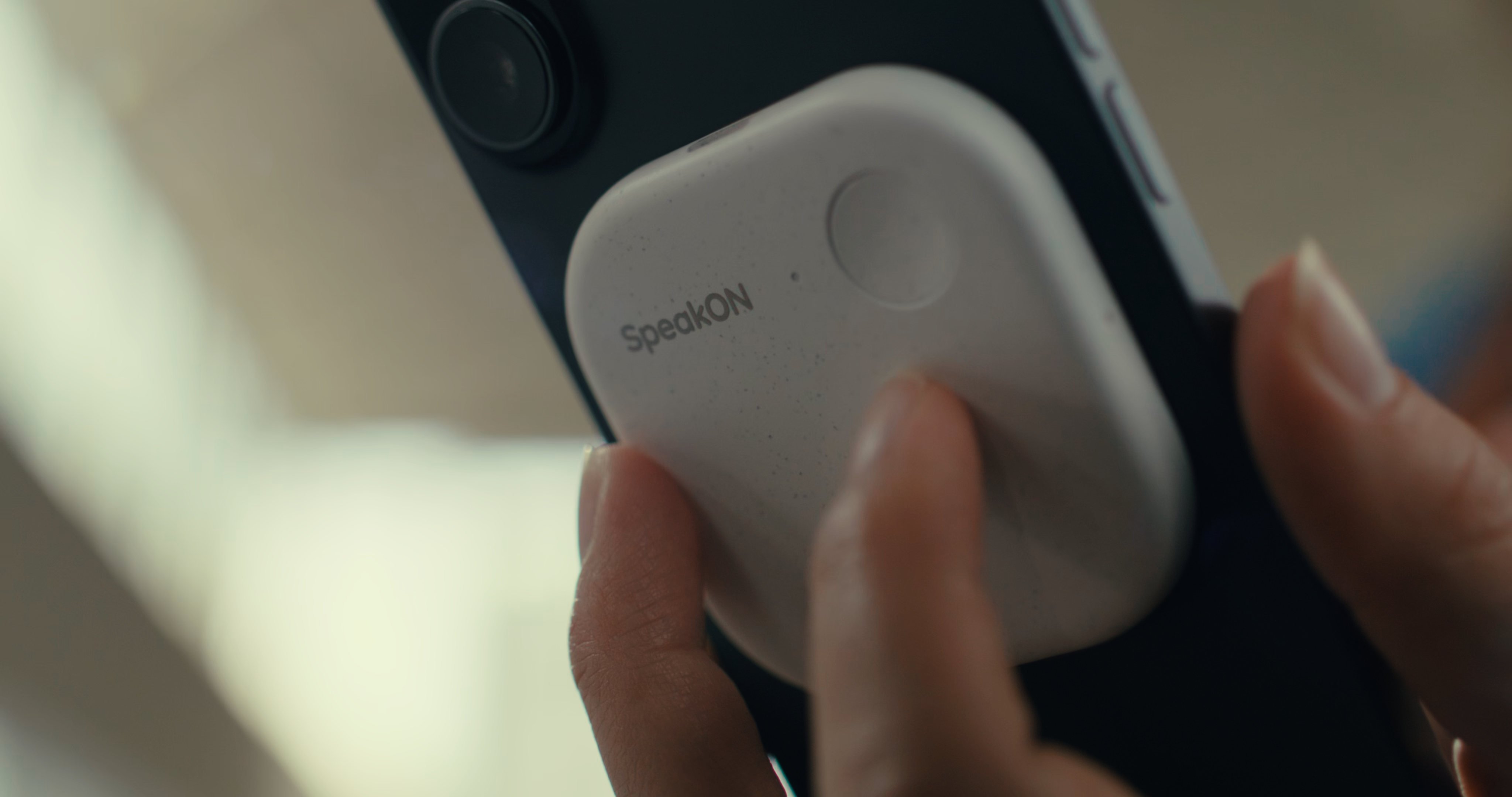 SpeakON MagSafe AI button in use by business professions using iPhones.