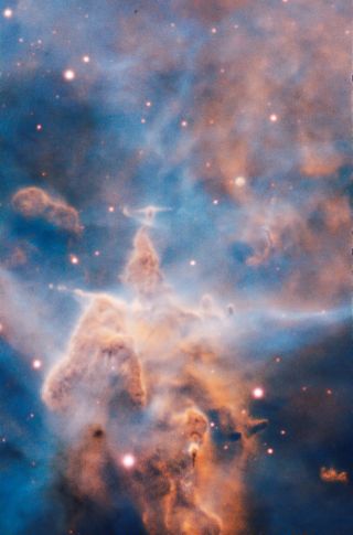 This majestic pillar of the Carina Nebula (NGC 3372) is a 3-light-year-tall cloud of gas and dust that is being eaten away by the brilliant light from stars both in its surroundings and inside the cloud itself. The European Southern Observatory's Very Large Telescope in Chile created the image with the Multi Unit Spectroscopic Explorer (MUSE) instrument.