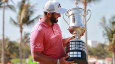 Jon Rahm holds the Mexico Open trophy in 2022