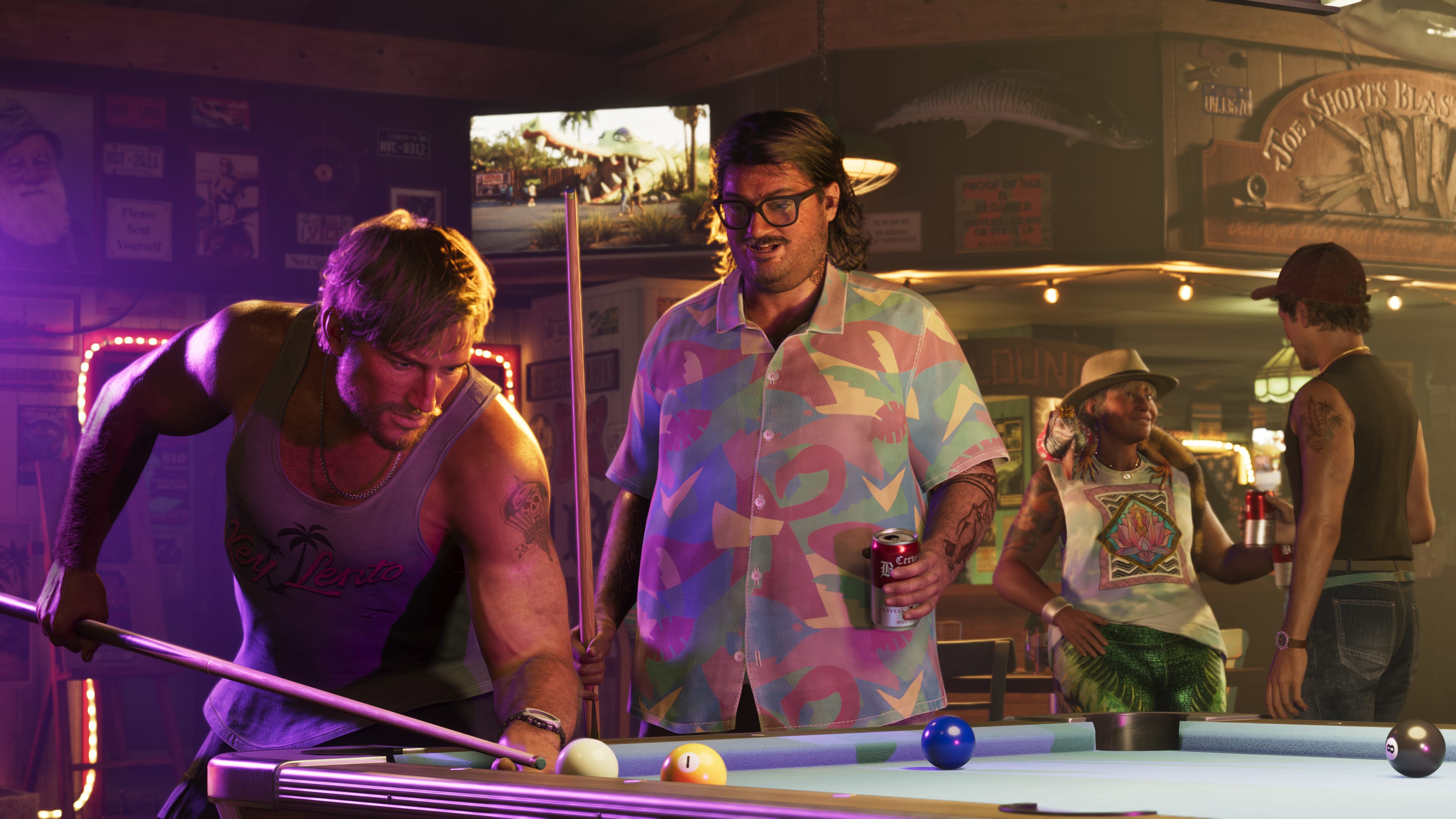 Jason and Cal Hampton play pool in a bar, both holding pool cues
