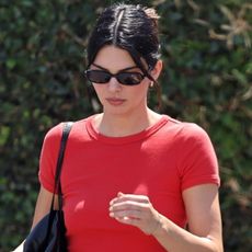 Kendall Jenner pulled off Hailey Bieber's indigo denim trend in low-rise jeans and flip-flops