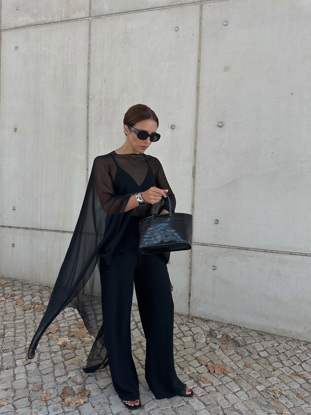 Debora Rosa wearing a sheer poncho