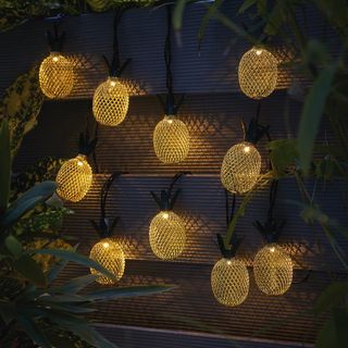 asda pineapple solar powered led string lights in garden