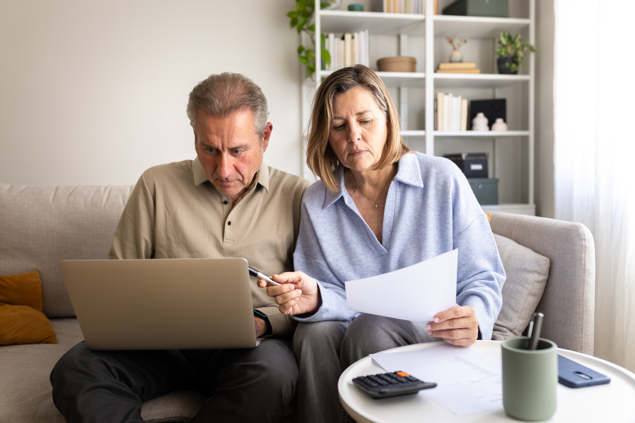 Couple at home assessing inheritance tax on their pensions