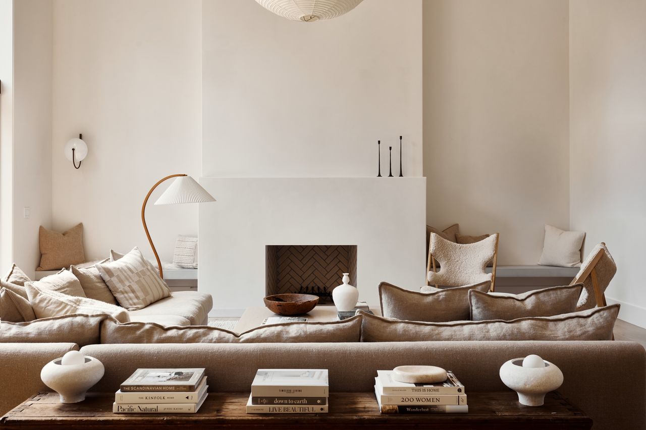 what couch color makes a room look bigger; grey linen sofa in grey living room by Lisa Staton Design