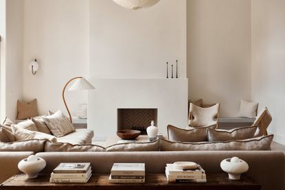 what couch color makes a room look bigger; grey linen sofa in grey living room by Lisa Staton Design