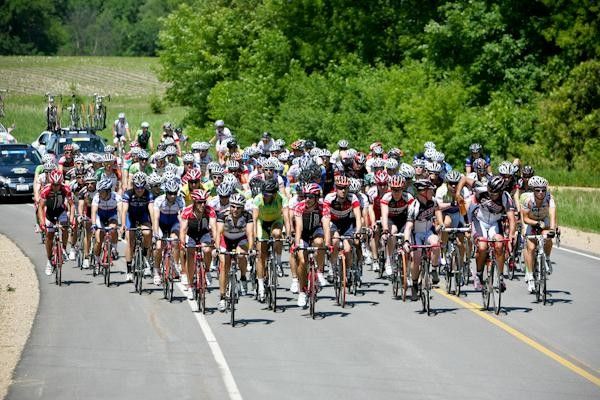 The main bunch takes no interest in the riders up the road.
