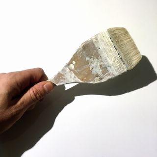 Picture of hand holding paintbrush