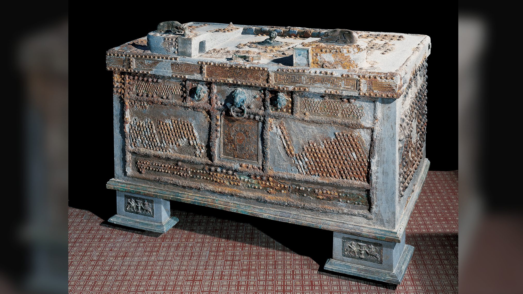 a metal strong box with decorations from ancient Oplontis