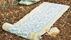 beach mat crafts with books and pillow and bottle