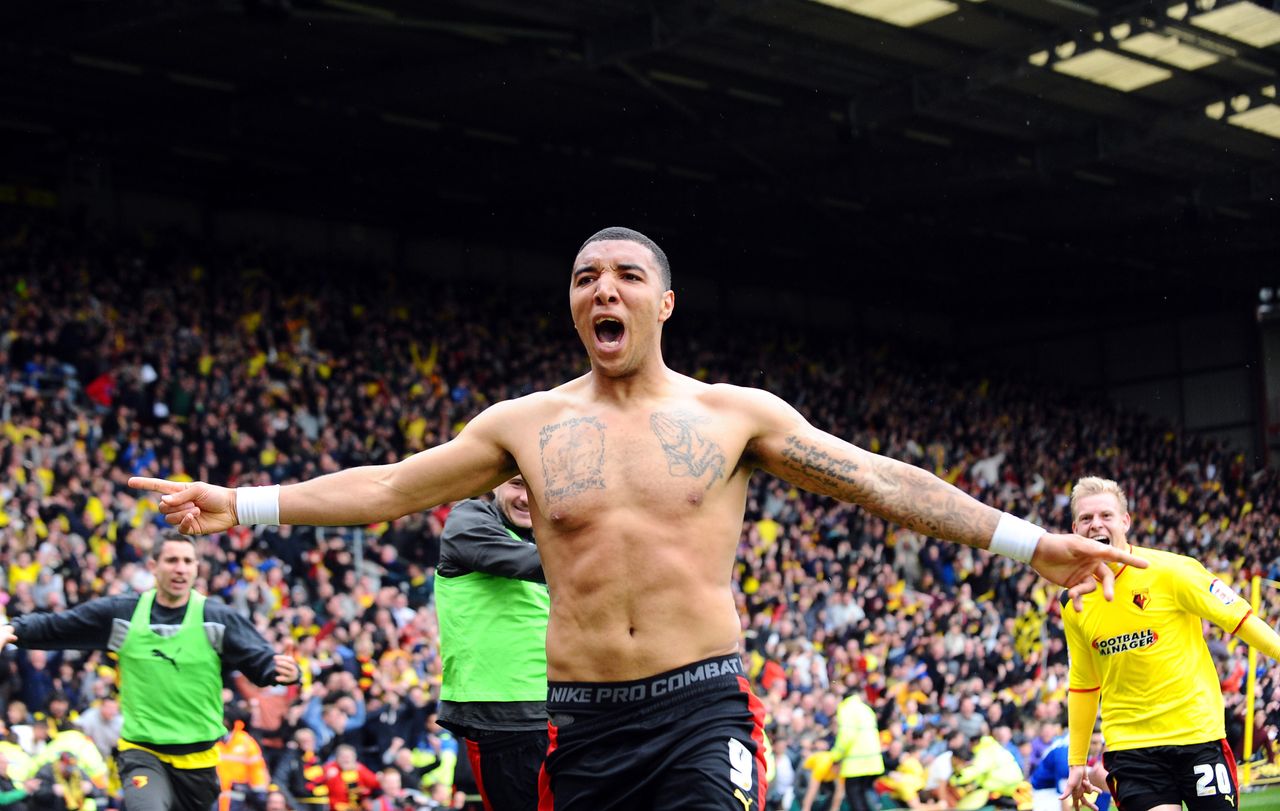 Troy Deeney celebrates, with his shirt removed, after scoring the winning goal for Watford against Leicester City in the Championship play-off semi-final second leg match at Vicarage Road, May 2013