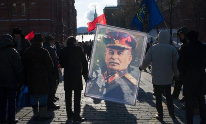 Stalin&amp;#039;s fans carry the long-dead leader&amp;#039;s portrait through Moscow&amp;#039;s Red Square on March 5.