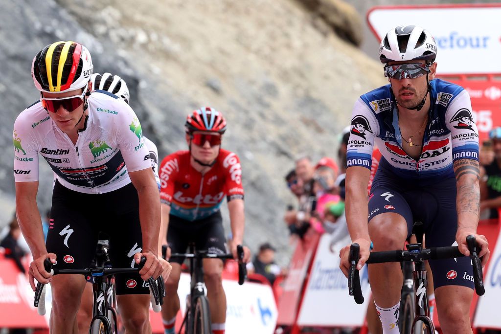 COL DU TOURMALET FRANCE SEPTEMBER 08 LR Remco Evenepoel of Belgium White best young jersey and Mattia Cattaneo of Italy and Team Soudal Quick Step cross the finish line during the 78th Tour of Spain 2023 a 1347km stage from Formigal Huesca la Magia to Col du Tourmalet 2115m UCIWT on September 08 2023 in Col du Tourmalet France Photo by Alexander HassensteinGetty Images