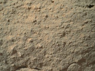 This image shows the full photo from Mars rover Curiosity of a strange transparent feature on a rock, which some have nicknamed a "flower." It appears at lower left. Image taken Dec. 19, 2012.