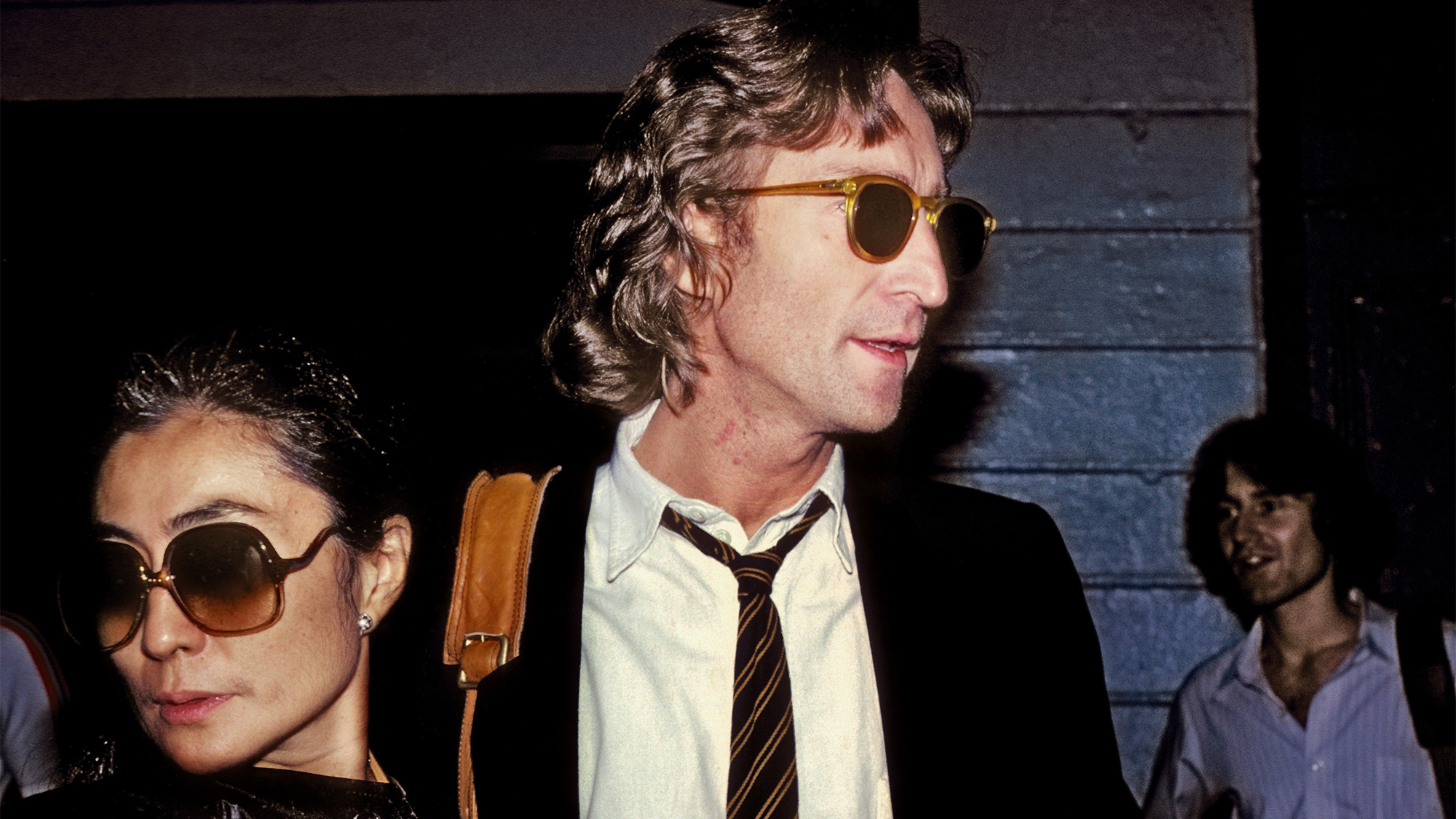 John Lennon and Yoko Ono outside of the Times Square recording studio 'The Hit Factory' before a recording session of his final album 'Double Fanasy' in August 1980 in New York City, New York.