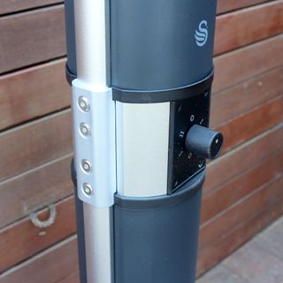 The Swan column patio heater being tested on a wooden deck