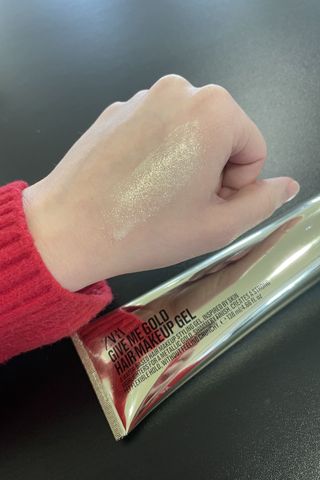valeza's hand with the gold glitter zara hair gel swatched
