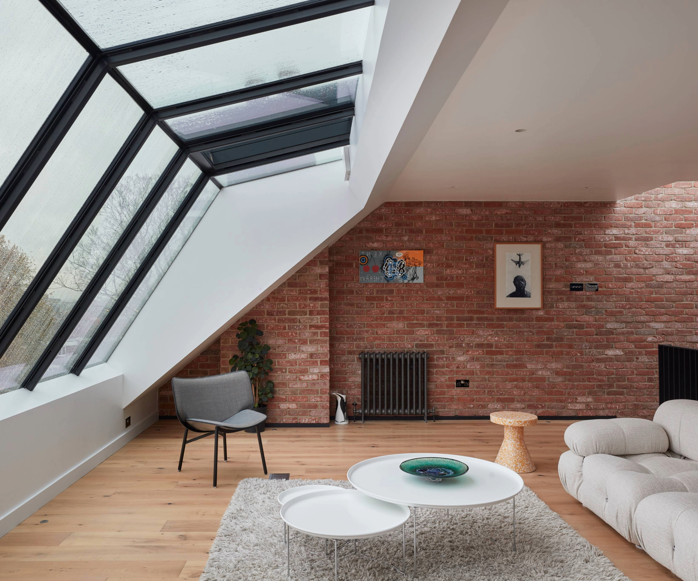 Loft conversion with red brick walls 