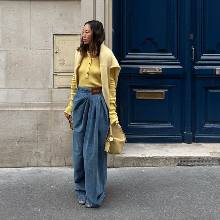 Aimee Song wearing a yellow sweater