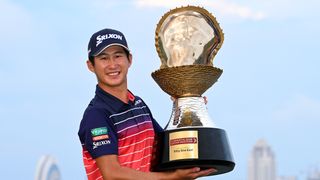 Rikuya Hoshino holding the Commercial Bank Qatar Masters trophy