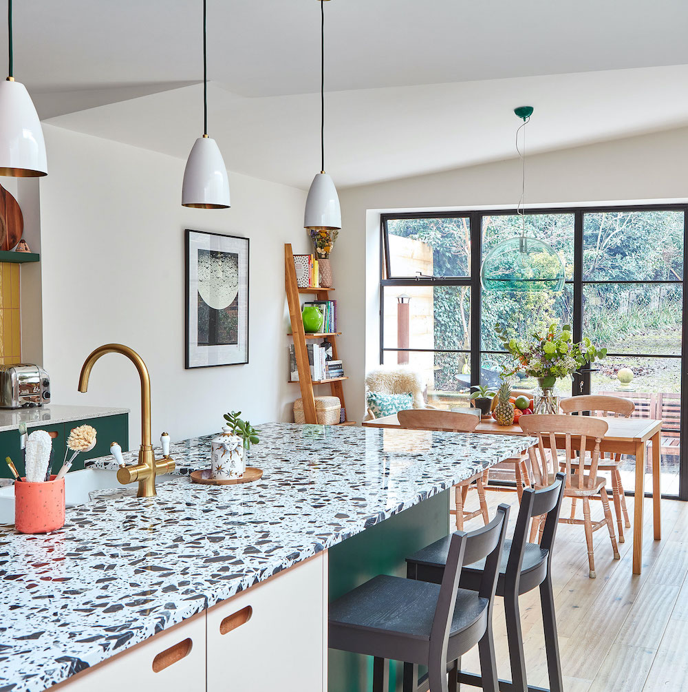 kitchen with dinner table and garden view