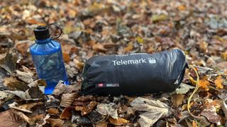 Nordisk Telemark 2.2 LW tent packed up in carry sack with water bottle for size comparison