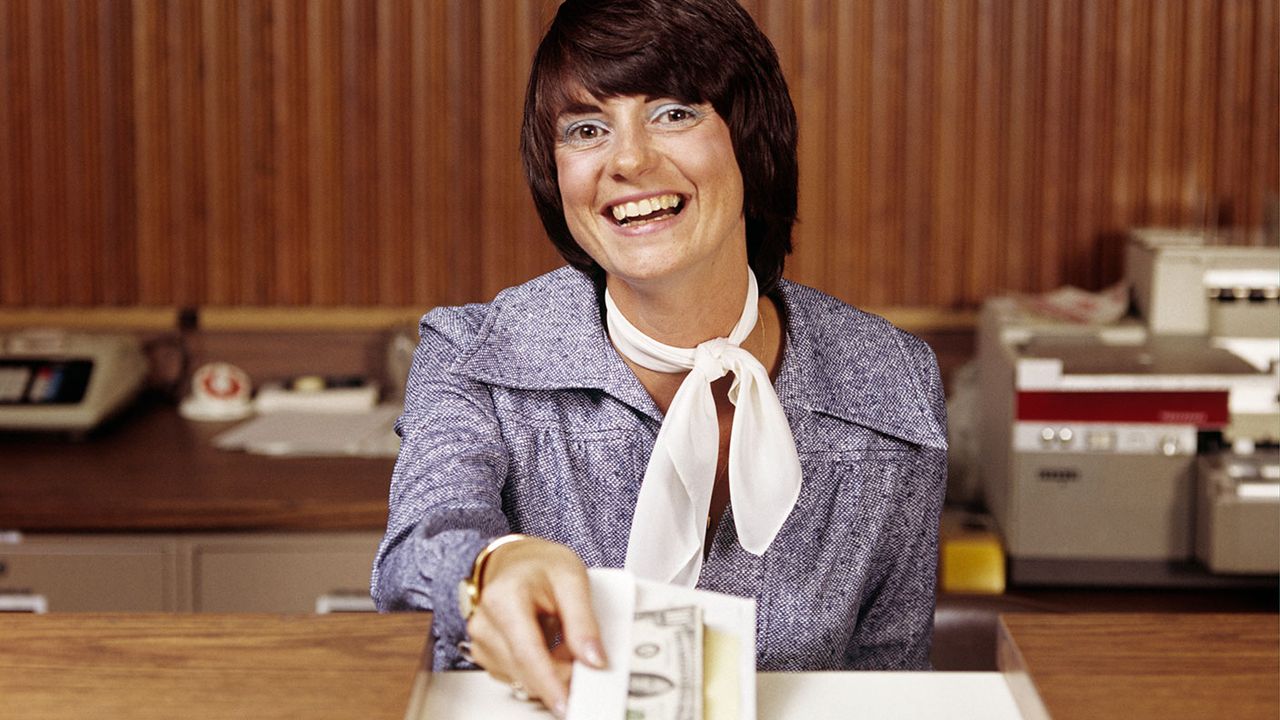 Bank clerk handing over cash