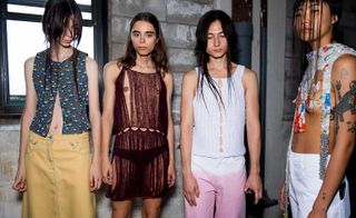 Eckhaus Latta S/S 2019 models dressed in transparent dresses and cut out tops