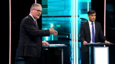 Labour Party leader Keir Starmer (L) and Prime Minister Rishi Sunak speak on stage during the first head-to-head debate of the General Election