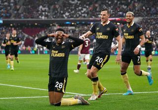 Joe Willock, left, celebrates the equaliser