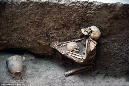 The 4,000-year-old remains of a mother and child embracing.