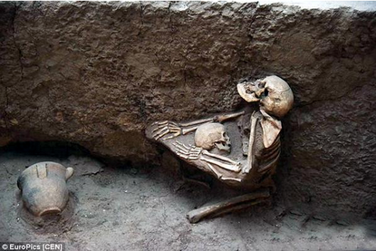 Archaeologists find 4,000-year-old remains of a mother embracing her child  at China's 'Pompeii of the East' | The Week