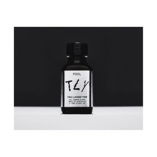 scented oil in black glass bottle