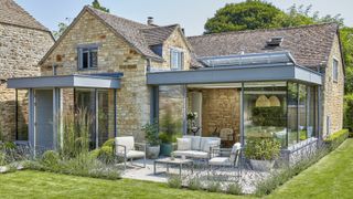 stone property with contemporary extension and screened outdoor patio area