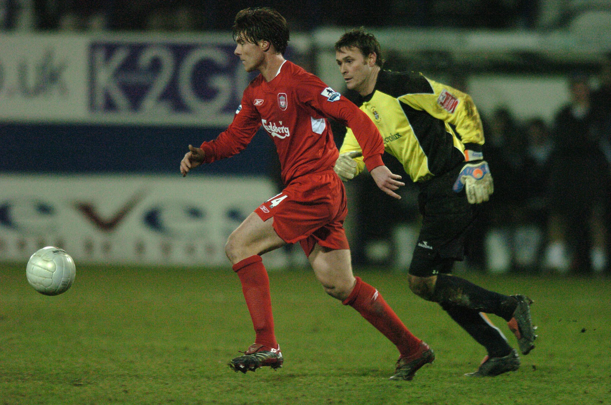 Liverpool's Xabi Alonso gets past Luton Town goalkeeper Marlon Beresford and prepares to shoot and score from his own half, 2006