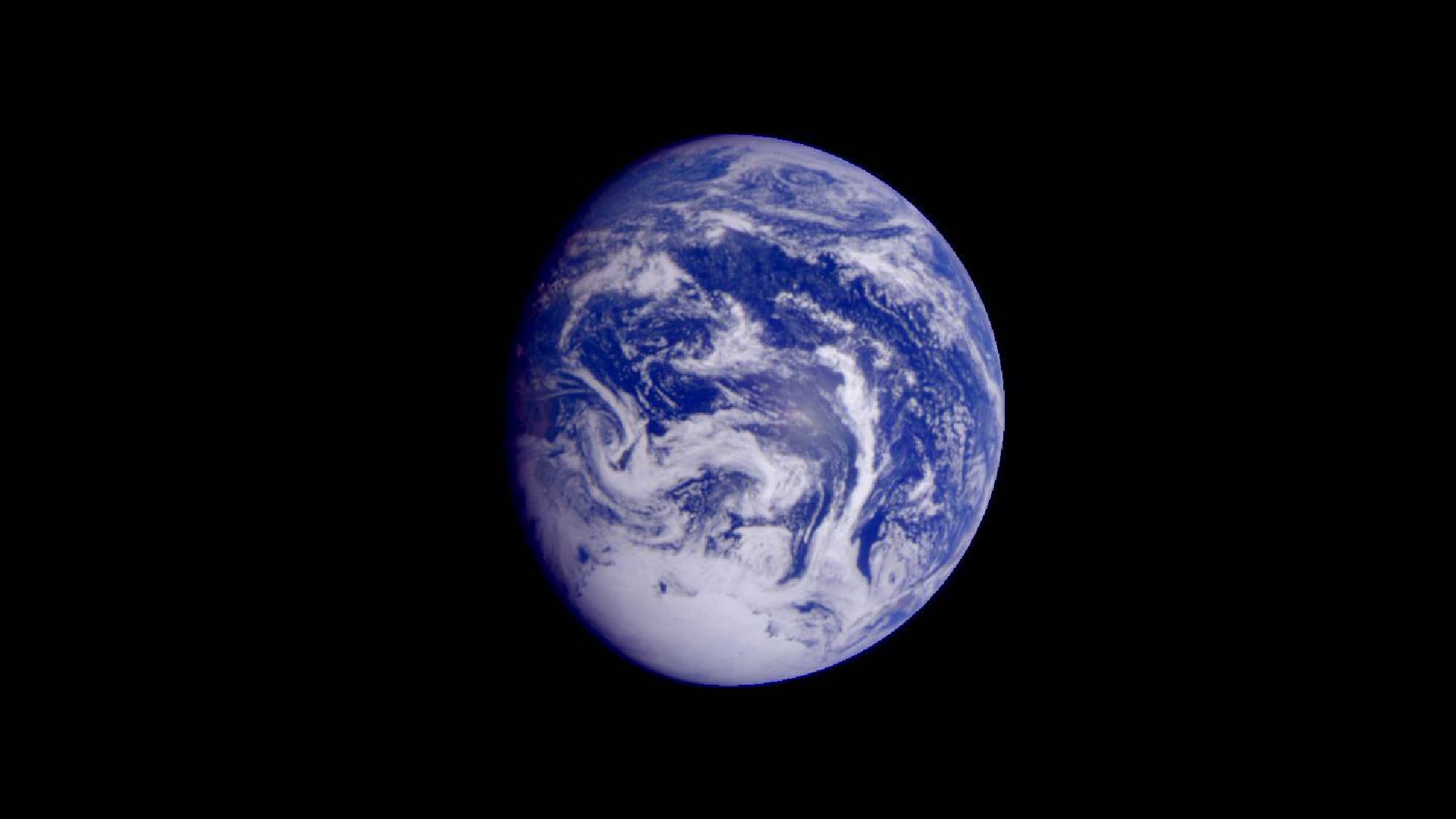 An image of Earth from space, with only ocean and clouds visible.