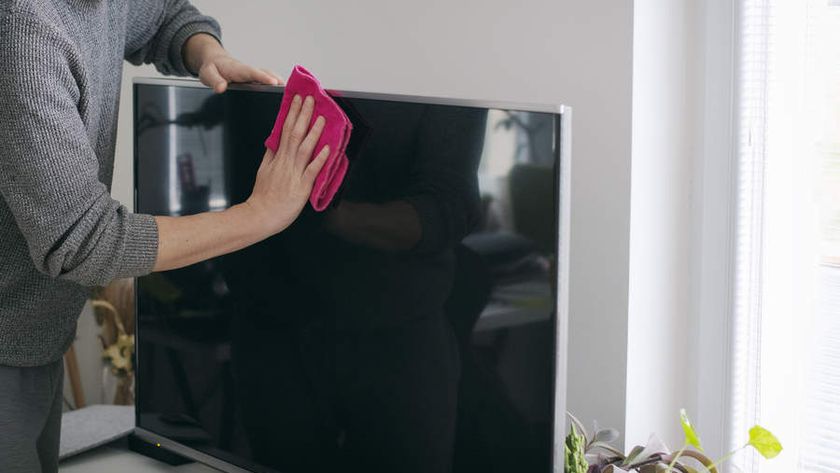  Close up of man cleaning TV screen