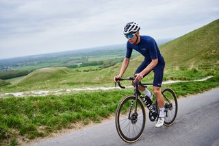 road cyclist against scenic background side on
