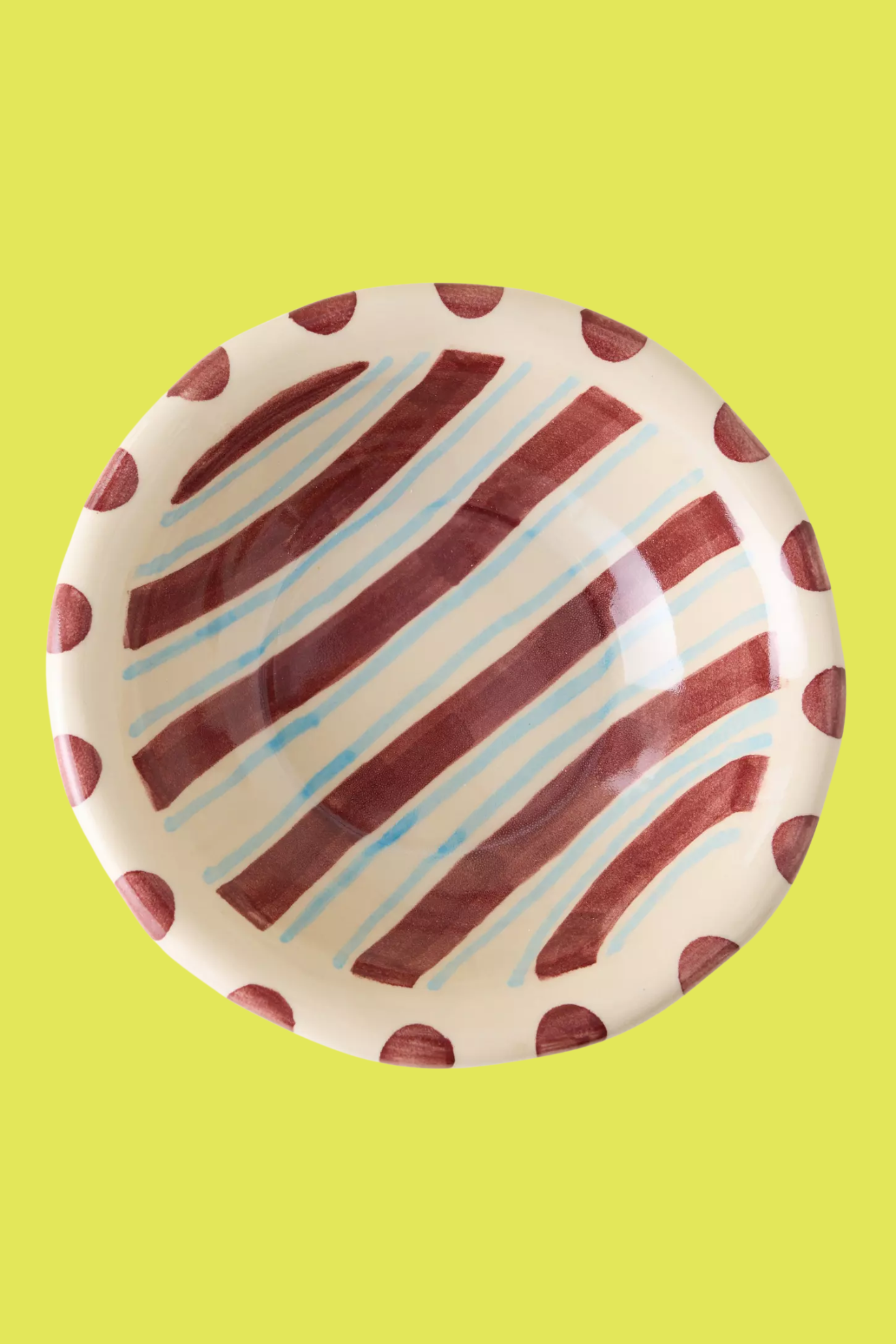 A striped and spotted ceramic bowl