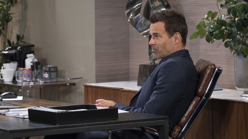 Cameron Mathison as Drew sitting in an office in General Hospital