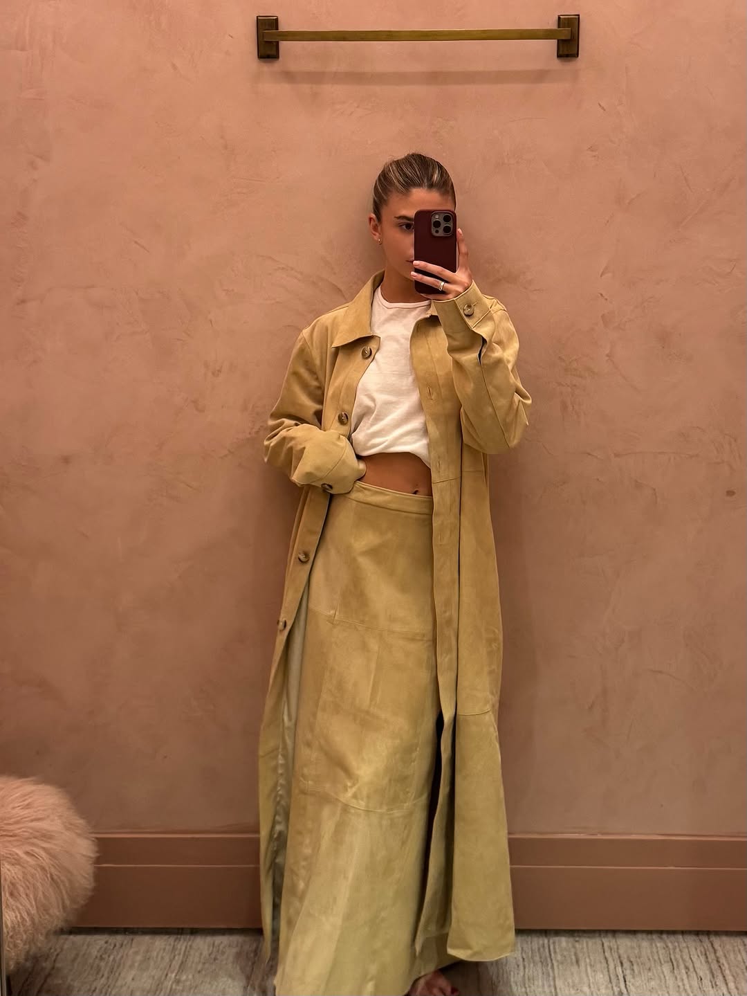 woman wearing winter to spring transitional capsule wardrobe 2026