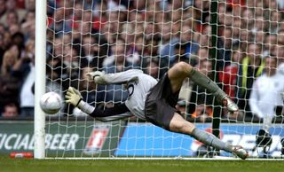 Jens Lehmann saves Paul Scholes's spot kick as Arsenal became the first club to win the FA Cup after a penalty shoot-out in 2005