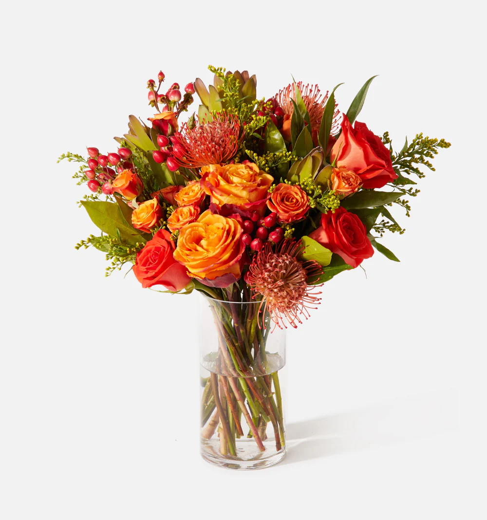 The Spice bouquet from UrbanStems in a clear glass vase