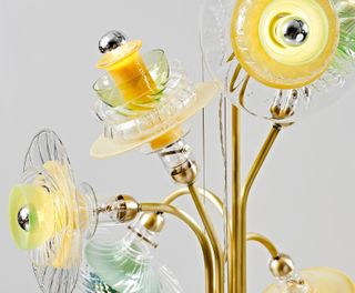 Chandelier with glass shades in yellow and clear glass.